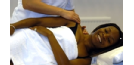 Male osteopath with female patient